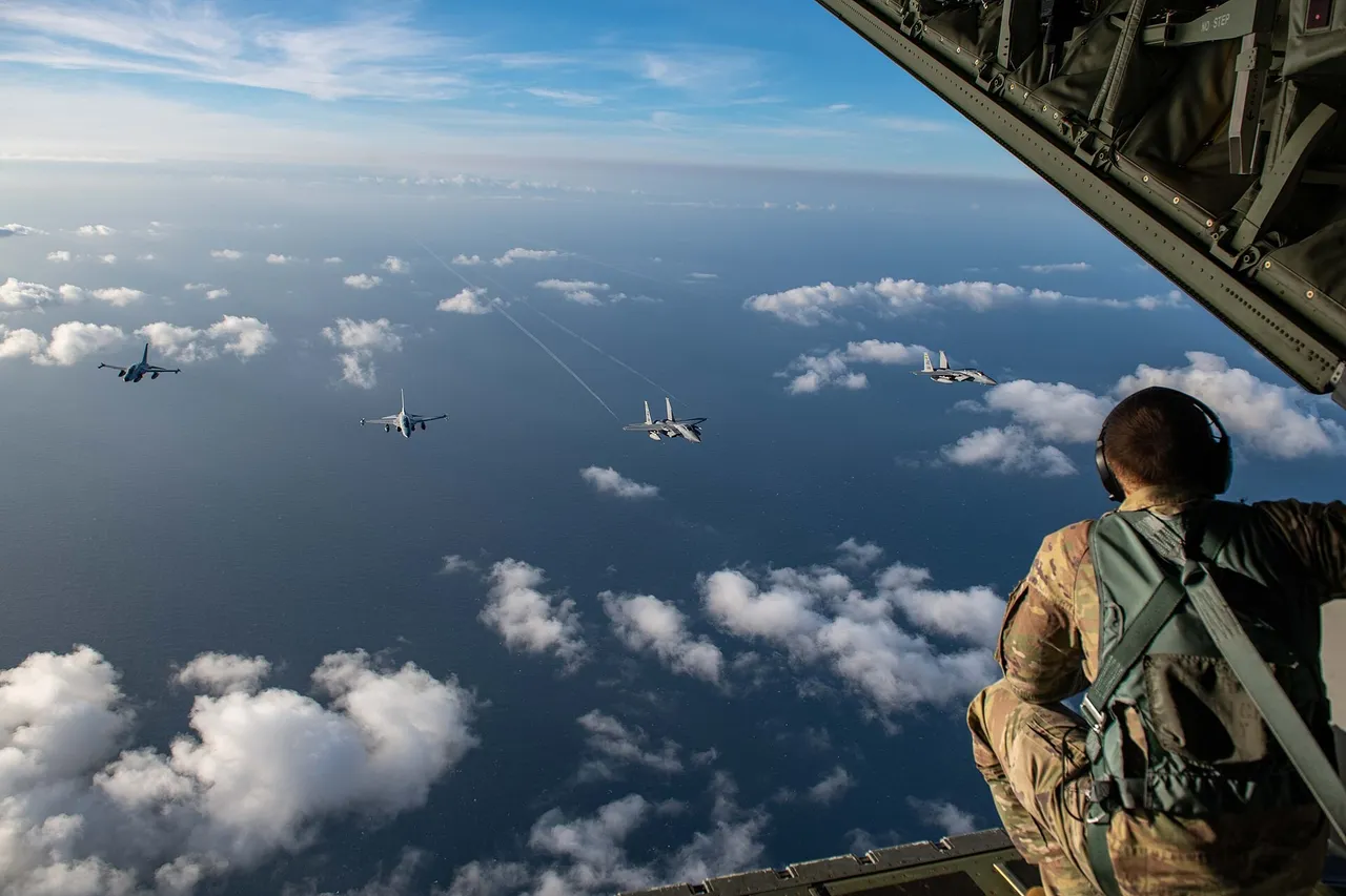 Two grey FA-50 light combat jets fly in formation with two US F-15C fighters above the sea