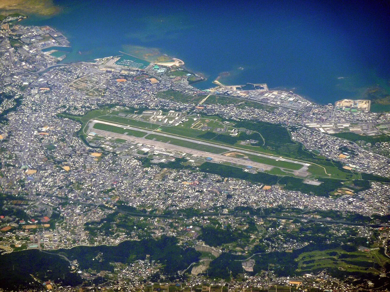 Aerial view of Marine Corps Air Station Futenma and the surrounding city of Ginowan in Okinawa.
