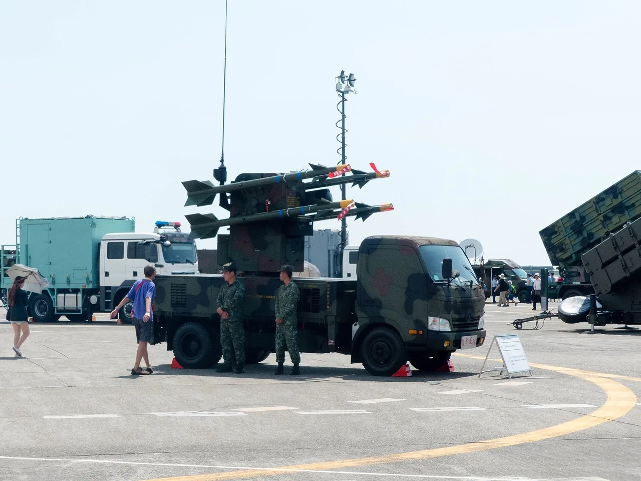 A light truck carrying a four-missile air defence launcher parked on an air base apron