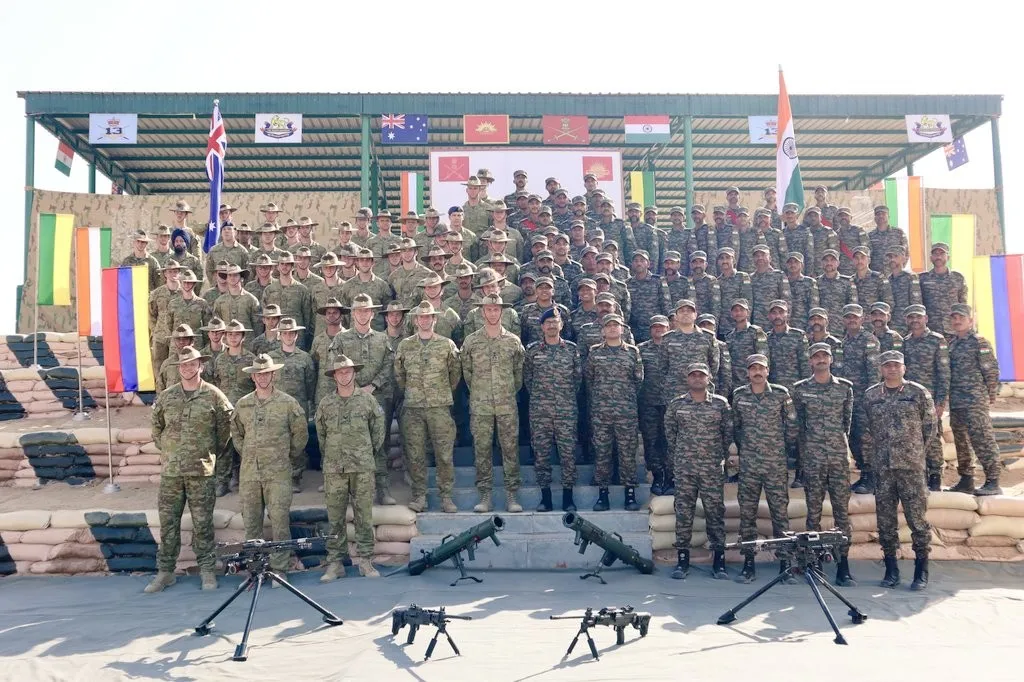 Indian and Australian army soldiers standing in formation at the opening ceremony of an AustraHind exercise