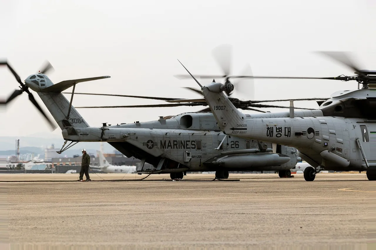 South Korean Marine Corps transport helicopter with Korean markings parked beside a large US Marine Corps CH-53E helicopter on an airfield