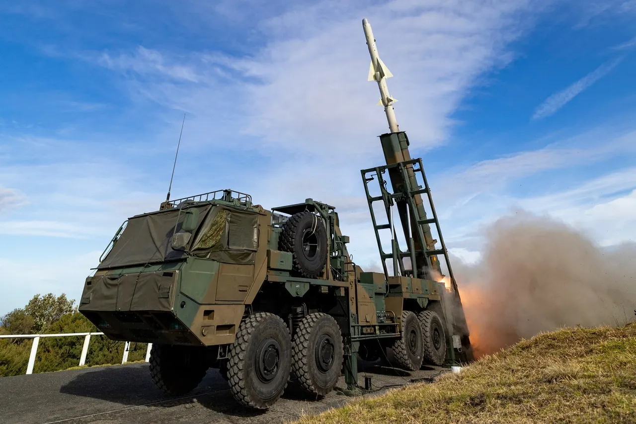 A surface-to-ship missile leaves a truck-mounted launcher in a burst of flame and smoke on a coastal range