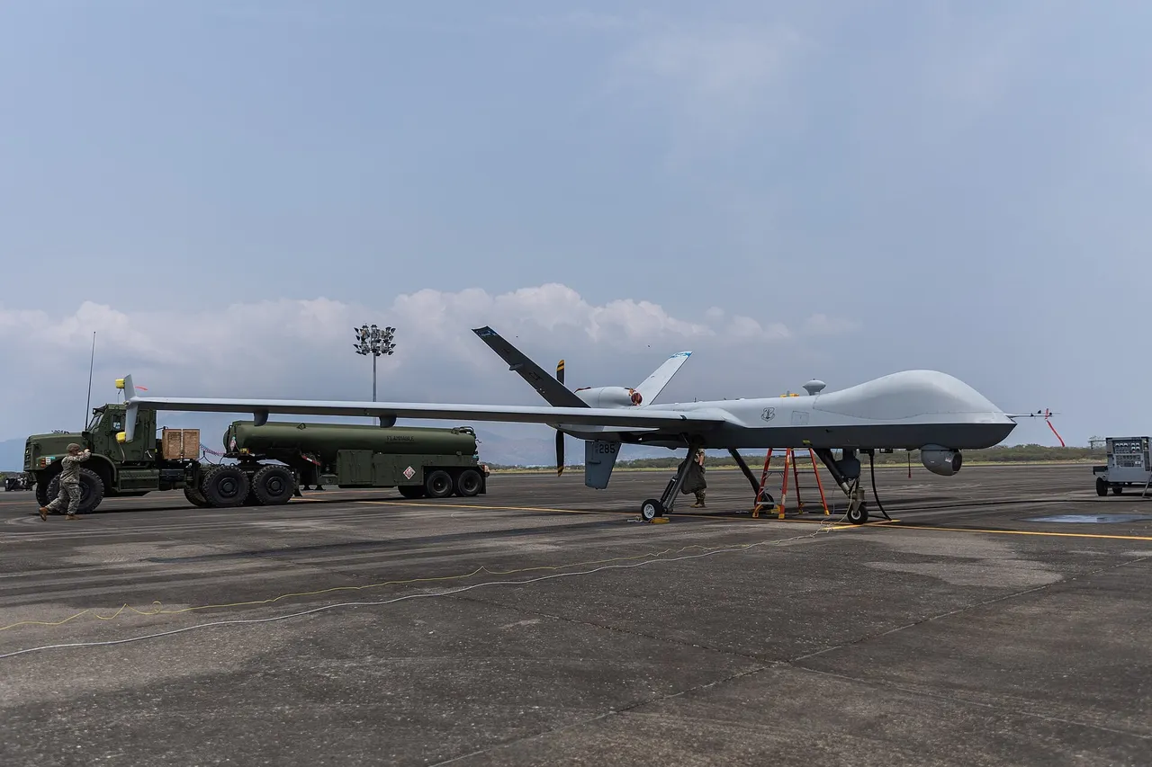 US Marines beside an MQ-9A Reaper drone on an airfield in the Philippines