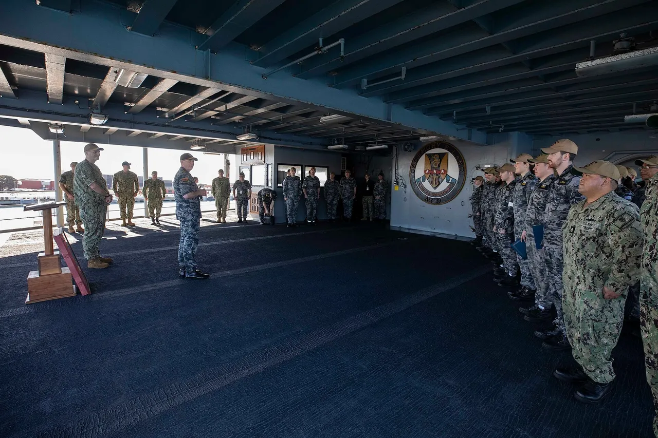 Australian Vice Admiral Mark Hammond in naval uniform standing aboard a US Navy ship