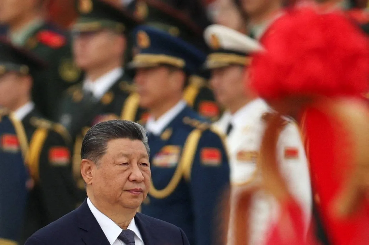 Chinese President Xi Jinping walking past PLA members at a Martyrs' Day ceremony in Beijing.