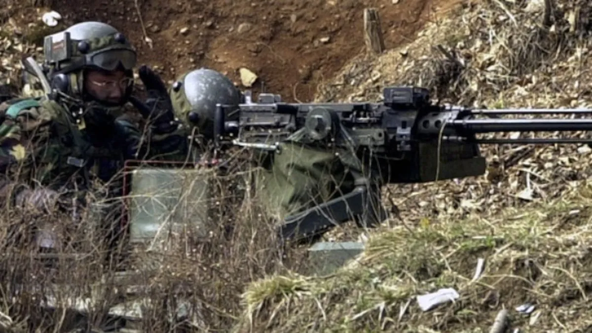 Two South Korean soldiers in helmets crouch behind a mounted K6 heavy machine gun in a dug-in position