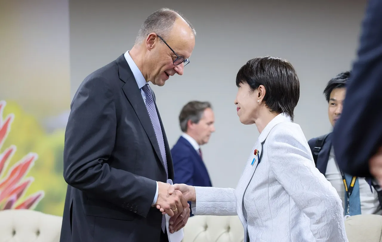 Japanese Prime Minister Sanae Takaichi talking with German Chancellor Friedrich Merz at a G20 meeting