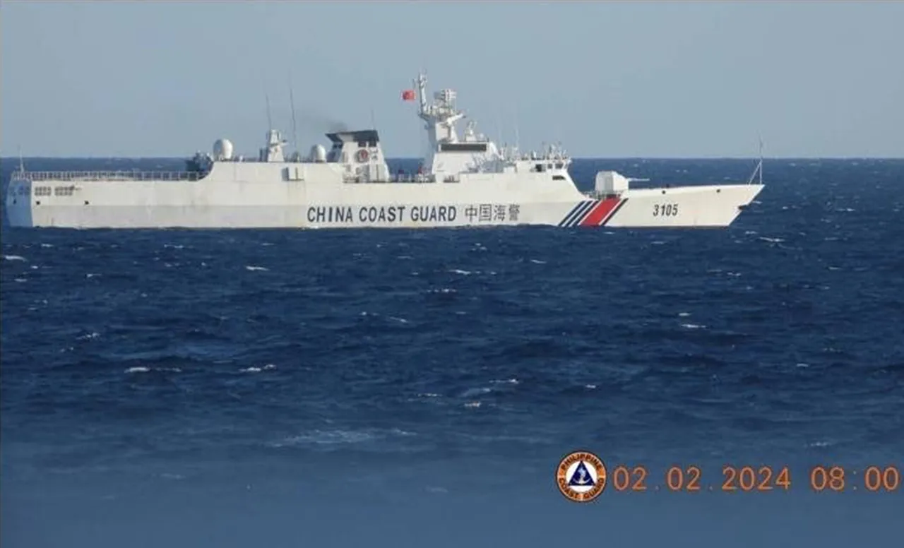 A white China Coast Guard patrol ship with hull number 3105 and a red and blue stripe sails on dark blue open sea.