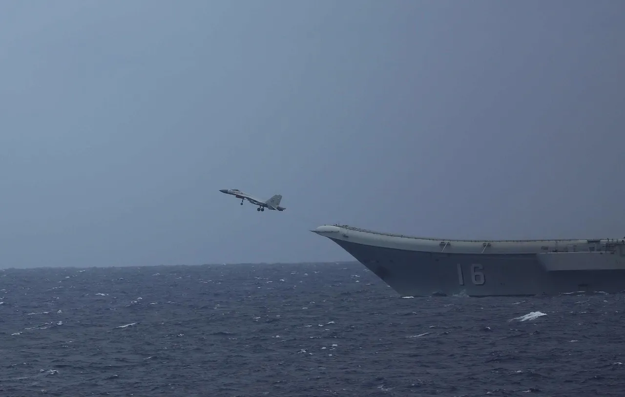 A Chinese J-15 fighter jet lifts off the ski-jump bow of the aircraft carrier Liaoning at sea