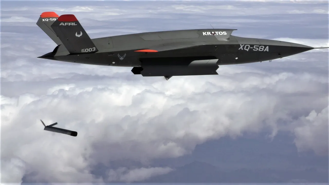A dark grey XQ-58A Valkyrie jet drone flies above the clouds as a small Altius-600 drone falls away below it after release