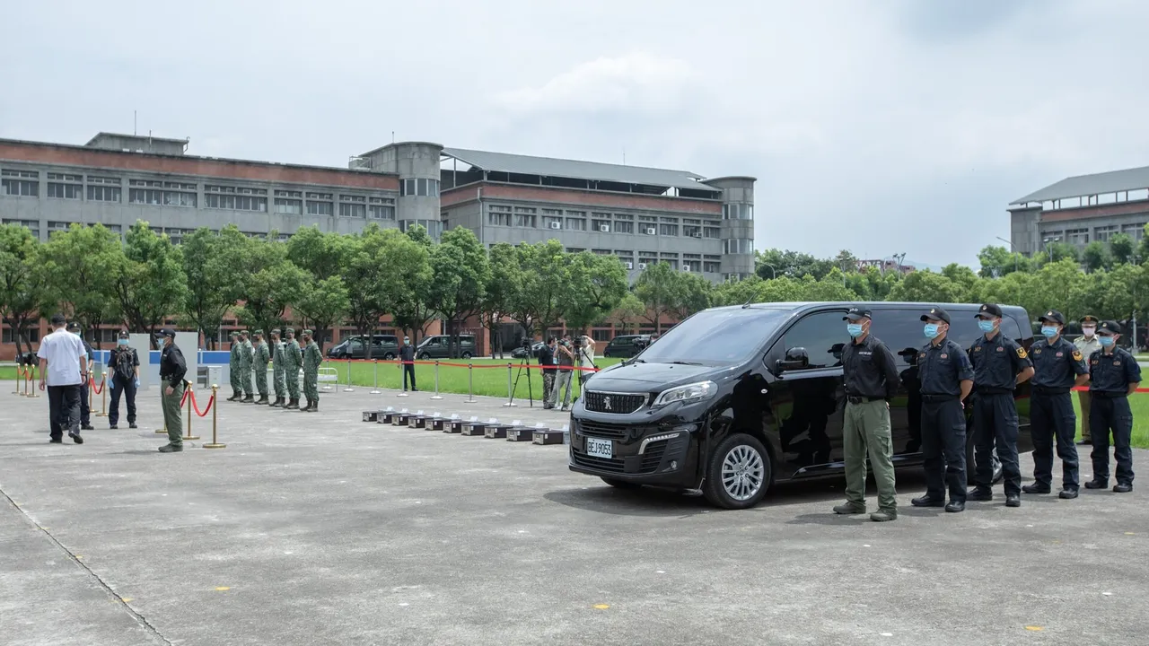 Taiwanese military police in dark uniforms standing beside a black van, with soldiers in camouflage lined up across a parade ground