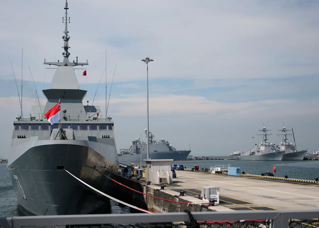 Grey Republic of Singapore Navy stealth frigate RSS Supreme with hull number 73 moored at a naval base pier