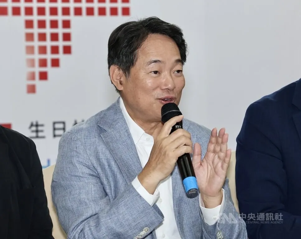 Official speaking at a podium during a Taipei press event on conscription standards