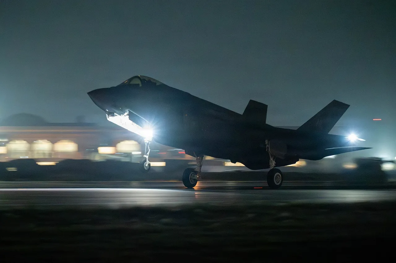 A grey US Air Force F-35A stealth fighter landing on a runway at Jodhpur Air Force Station in India.