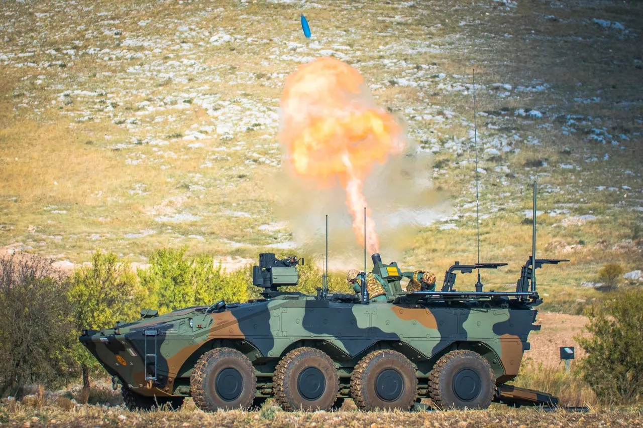 An Italian Army eight-wheeled Freccia armoured mortar carrier with troops during a field exercise