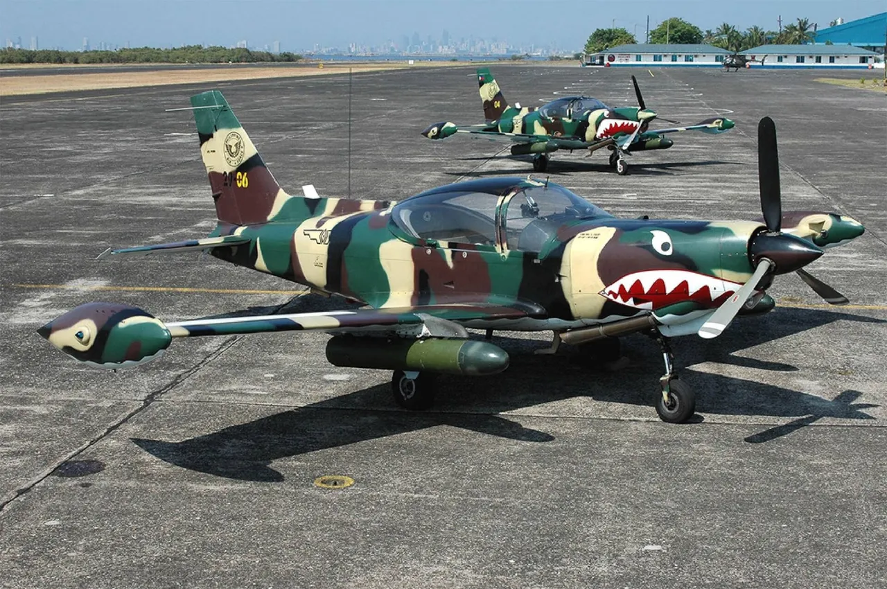 A row of small single-engine Philippine Air Force propeller aircraft parked on a runway