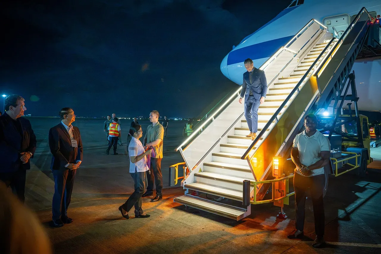Pete Hegseth shaking hands with officials on the tarmac at Mactan-Cebu International Airport