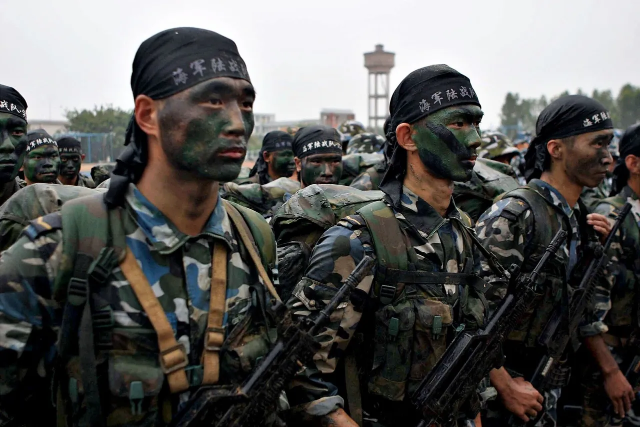 Rows of Chinese navy marines in camouflage uniforms standing at attention outdoors as a US Navy officer greets them