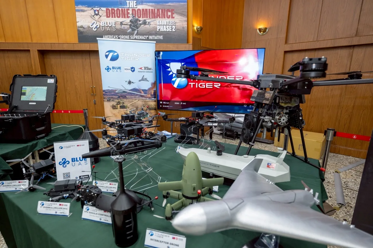 Military and commercial drones displayed on a table at a Taiwanese industry event