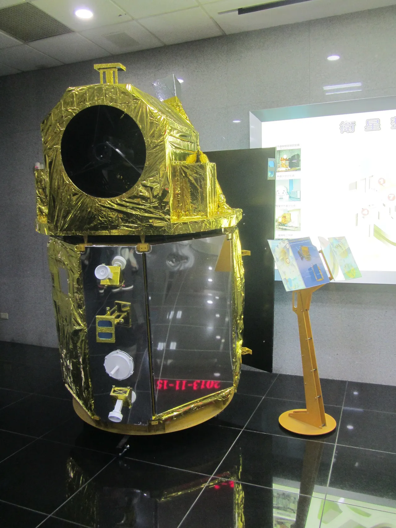 A white remote-sensing satellite model displayed indoors at Taiwan's national space facility