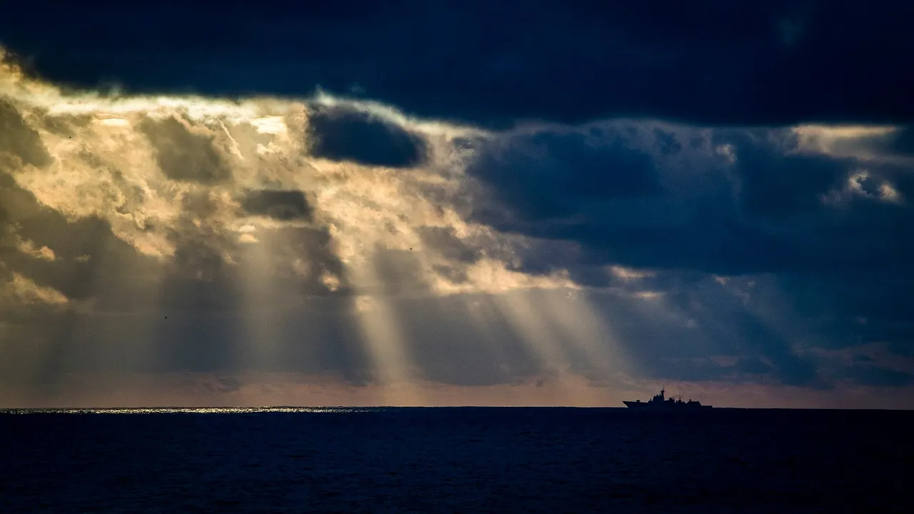 A grey Chinese navy destroyer with hull number 174 sailing on open sea