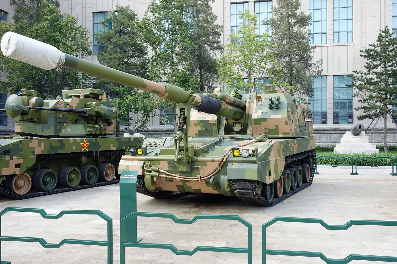 A camouflaged Chinese tracked self-propelled howitzer with a long barrel parked on a paved museum forecourt