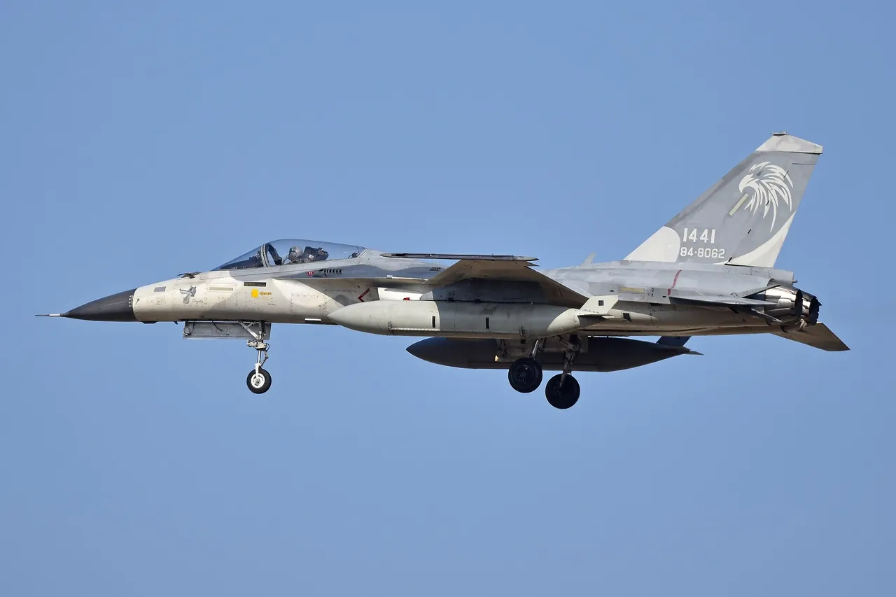 Grey Taiwanese F-CK-1C Ching-kuo fighter jet with landing gear down on approach against a pale sky