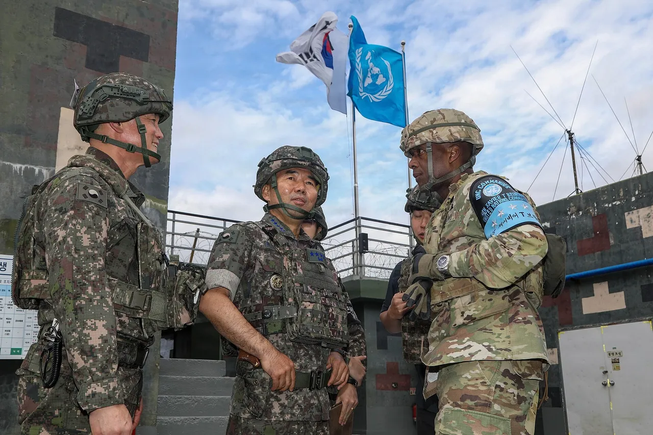 South Korean and US generals in combat helmets talk at a DMZ guard post beneath South Korean and United Nations flags